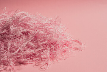 pink trend color with textile texture on pink background close up
