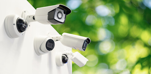 Surveillance cameras  on a green background. Perimeter security	