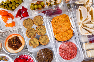 Variety of prepackaged food products in plastic boxes