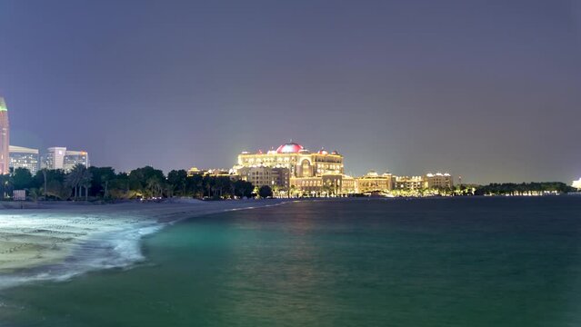 AbuDh-UAE-Feb,19 2023: Time lapse luxury hotel in city after sunset.