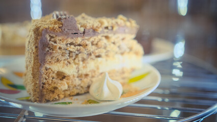 cakes and cupcakes in the window behind the glass slowly rotate