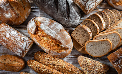 Assorted bakery products including loaves of bread and rolls