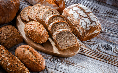 Assorted bakery products including loaves of bread and rolls