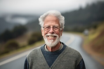 Portrait of senior man with eyeglasses smiling on the road