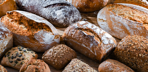 Assorted bakery products including loaves of bread and rolls