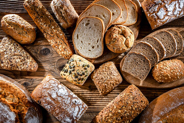 Assorted bakery products including loaves of bread and rolls