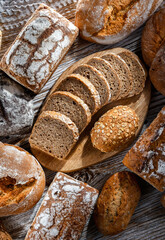 Assorted bakery products including loaves of bread and rolls