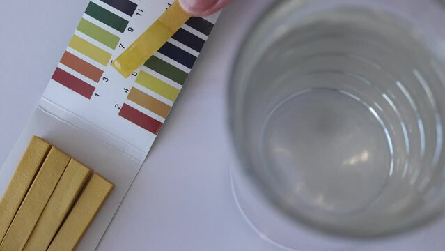 Measuring water pH with test strips