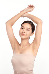 Beautiful Young Asian woman lifting hands up to show off clean and hygienic armpits or underarms on white background, Smooth armpit cleanliness and protection concept