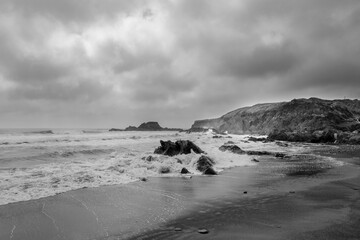 grey and stormy weather scenery at the shoreline