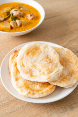 Chicken curry soup with roti