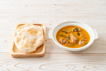 Chicken curry soup with roti