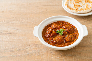 chicken tikka masala spicy curry meat food with roti or naan bread