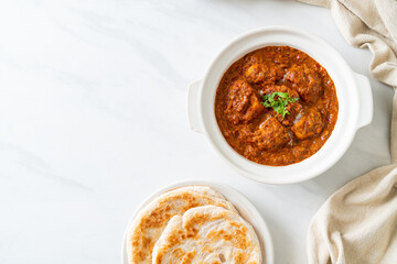 chicken tikka masala spicy curry meat food with roti or naan bread