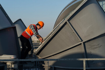 Engineer under checking the industry cooling tower air conditioner is water cooling tower air...