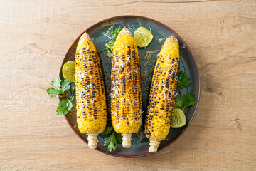 barbecue and grilled corn with cheese and lime