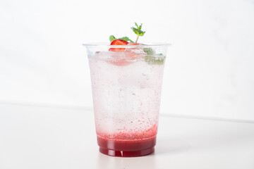 strawberry with soda in glass