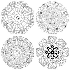 Hand drawn zentangle set of 4 mandalas for coloring page.