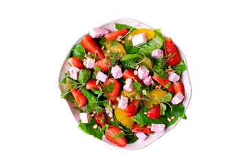 Isolated salad with strawberry, orange, red wine soaked cheese, Romaine lettuce leaves and pine...