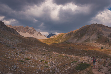 A male hiker on a path to the lac de Soulier (Hautes-Alpes, France)