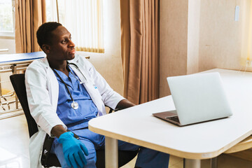Fototapeta na wymiar african american young man doctor relaxing at a break after finished consult and treatment patient at office in hospital.