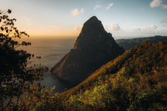 Pitons on Santa Lucia, La Souffriere bay during sunset with blue sky and cotton candy clouds. Caribbean Island. Vieux Fort, Saint Lucia. Travel and honeymoon concept.