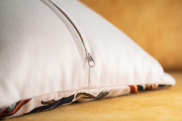 Pillow with zipper close up. Closed zipper clasp on decorative pillow. © ismailgazel