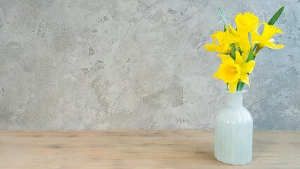 Bouquet of daffodils in a white vase