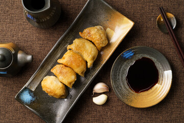 Special Chinese food raw fried dumplings on a monochrome background