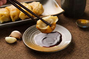 Special Chinese food raw fried dumplings on a monochrome background