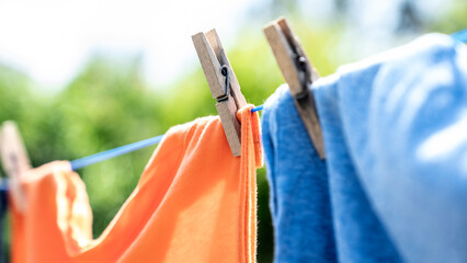 Clothes hanging to dry on a laundry line - obrazy, fototapety, plakaty