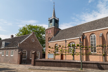 Reformed church from the 13th century in the picturesque Dutch village of Nigtevecht on the river Vecht.