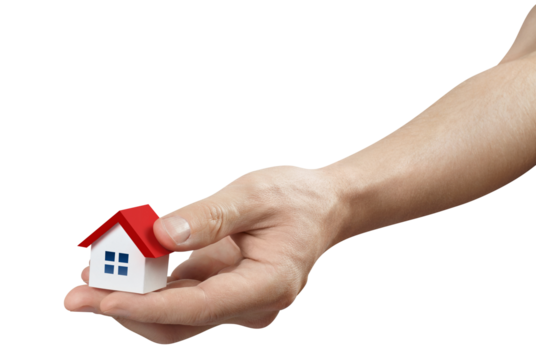Hand holding a small red roofed house, cut out