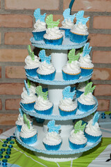 Individual Presentation Cupcakes Decorated With Whipped Cream; Baby Shower Theme