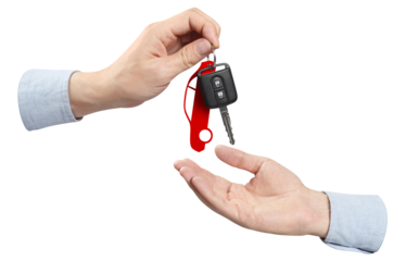 Two hands sharing car key, cut out