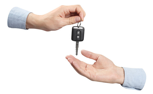 Two hands sharing car key, cut out