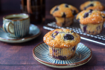 homemade blueberry muffins on wooden table background.