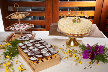 Reception Hall Decorated For Social Events; Dessert Table For Guests