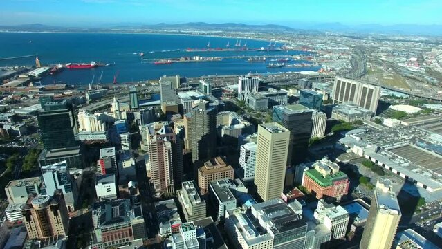 Architecture, buildings and skyline with drone of city in Cape Town for traffic, highway and urban road. Skyscraper, mountains and travel in grid of town with infrastructure, ocean and cars in street