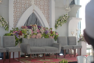 Minimalist wedding decoration. Beautiful wedding reception interior and decoration full of fresh flowers