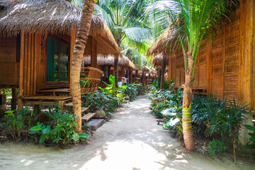 heavenly vacation on phi phi don island in thailand in a hotel with bamboo bungalow among palm trees