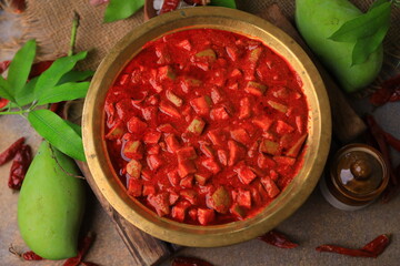 mango pickle or avakai pacchadi or mango achar indian pickles close up with selective focus and blur
