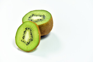 Slices of kiwifruit isolated on white background. High vitamin vegetables, fruits concept. For health and weight loss.