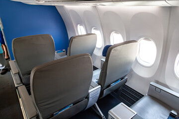 business class seats in an aircraft for a comfortable flight and passenger relaxation. luxury life and wealth.
