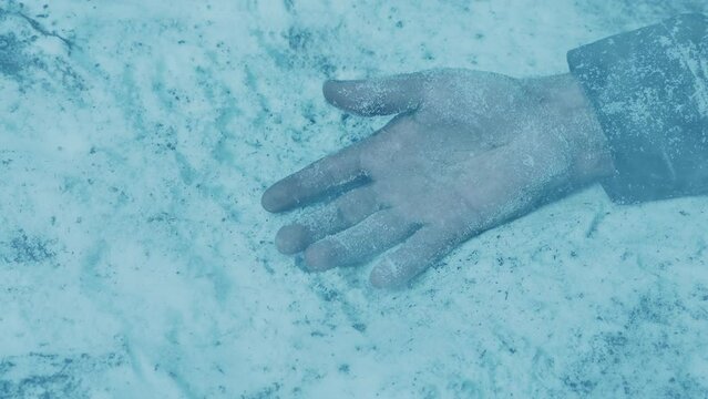 Dead Man On The Ground In Snowstorm