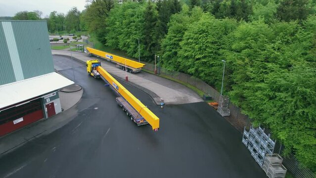 Oversized road transport. Truck delivers crane beam