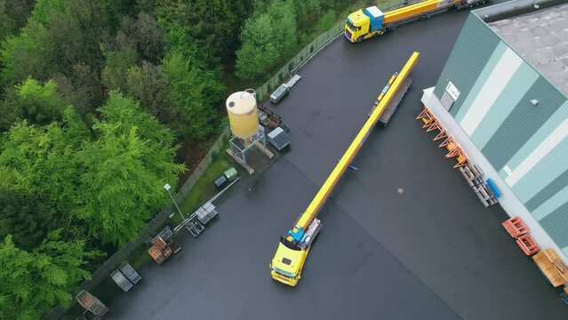 Truck with oversized cargo goes backwards. Transportation Crane Beam or Cathead