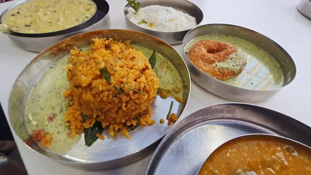 A view of healthy South Indian breakfast food varieties served on small plates
