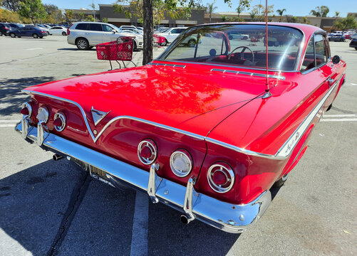 Los Angeles, California USA - March 28, 2021: red chevrolet impala retro car back corner view