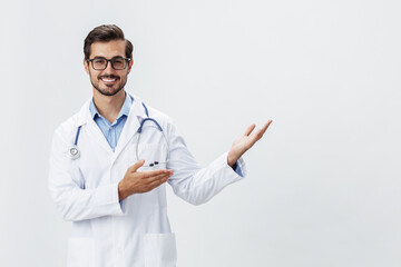 Man doctor in white coat and eyeglasses smile shows hand gestures signs on white isolated background looks into camera, copy space, space for text, health